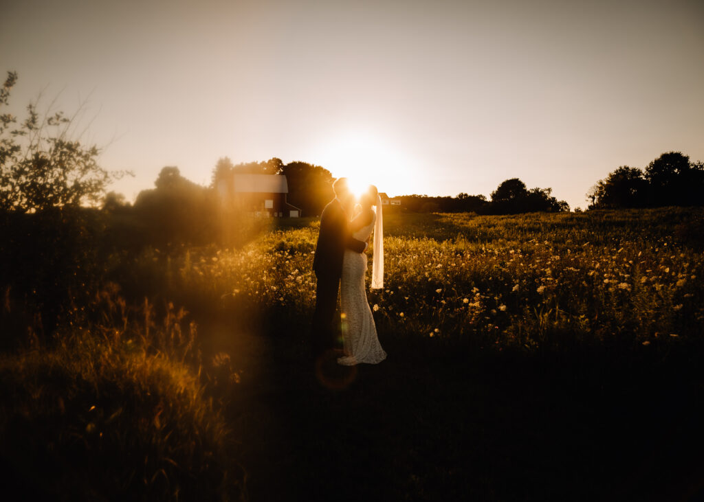 bride and groom photos in a field